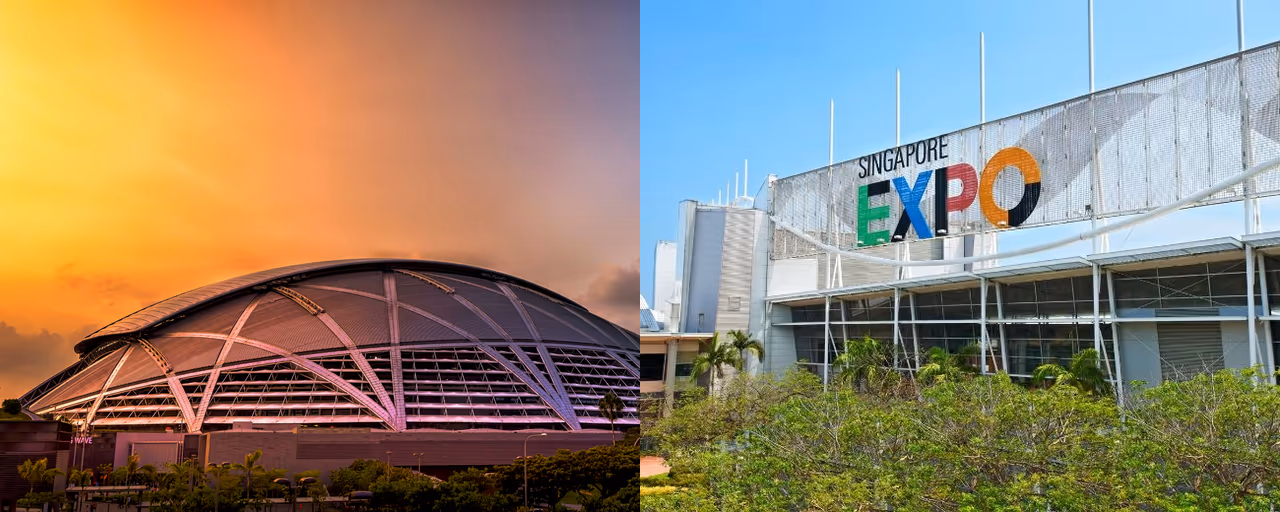 The domed National Stadium at the Singapore Sports Hub at sunset, beside the Singapore EXPO entrance sign